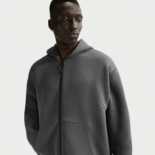 Zdjęcie produktu Bluza męska z dzianiny z kapturem i zamkiem na całej długości Nike Tech - Szary