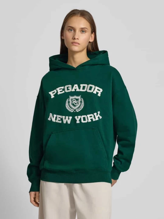 Zdjęcie produktu Bluza o kroju oversized z kapturem i wyhaftowanym logo model ‘Frieda’ Pegador Ciemnozielony