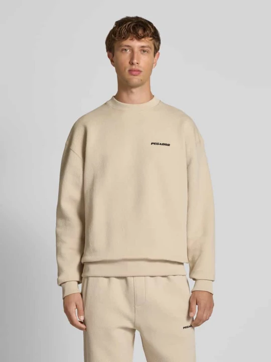 Zdjęcie produktu Bluza o kroju oversized z wyhaftowanym logo i okrągłym dekoltem Pegador Écru