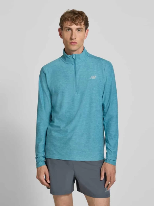 Zdjęcie produktu Bluza o kroju regular fit z kołnierzem zapinanym New Balance Petrol