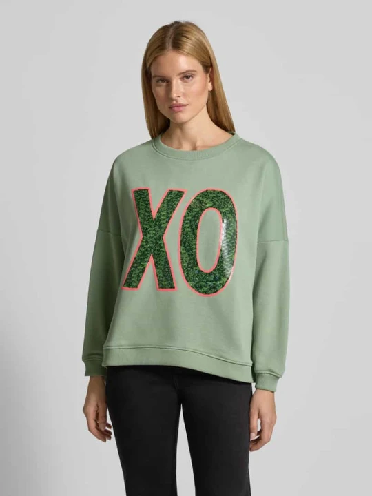 Zdjęcie produktu Bluza o kroju relaxed fit z cekinowym obszyciem model „XO” Miss Goodlife Limonkowy