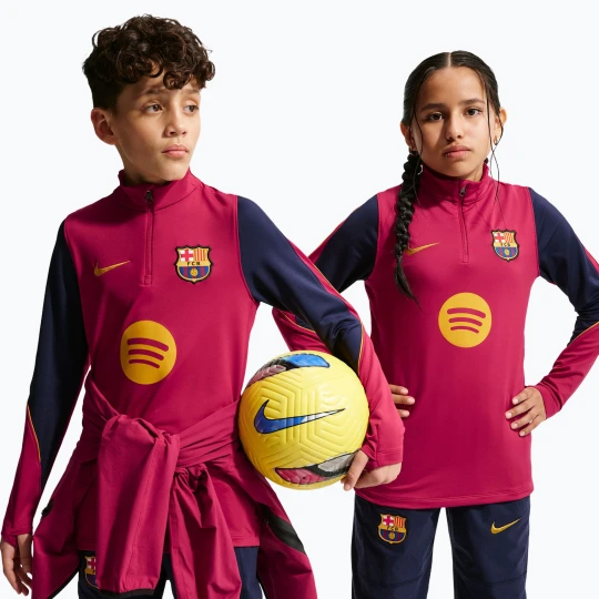 Zdjęcie produktu Bluza piłkarska dziecięca Nike FC Barcelona Strike Dri-Fit Soccer Knit Drill Top noble red/blackened blue/mineral yellow