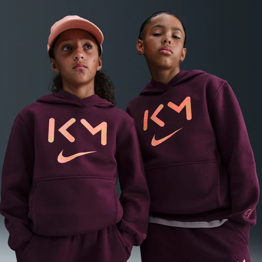 Zdjęcie produktu Bluza piłkarska z kapturem dla dużych dzieci Nike Dri-FIT Kylian Mbappé Club Fleece - Czerwony
