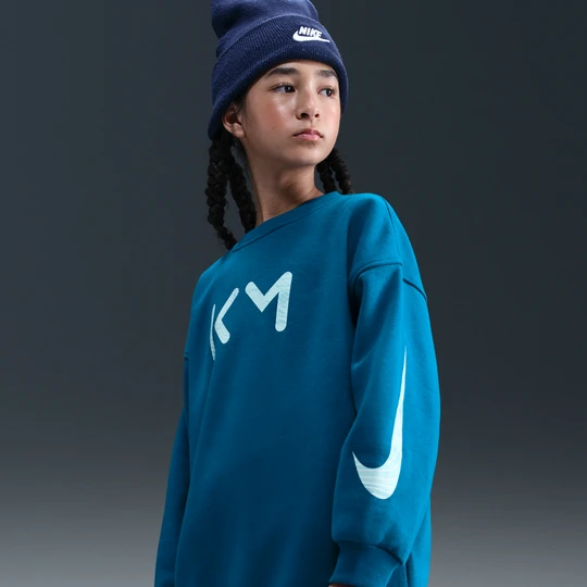 Zdjęcie produktu Bluza piłkarska z półokrągłym dekoltem o kroju oversize dla dużych dzieci (dziewcząt) Nike Kylian Mbappé Club Fleece - Niebieski