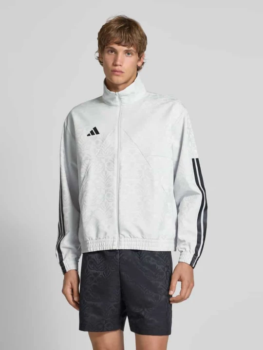 Zdjęcie produktu Bluza rozpinana o kroju relaxed fit z nadrukiem z logo model ‘Tiro’ Adidas Jasnoszary