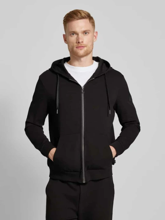 Zdjęcie produktu Bluza rozpinana męska JOOP! Collection; Mieszanka bawełny z dodatkiem streczu; Luźny krój; Model ‘Stratos’; Kaptur z tunelem; Zamek błyskawiczny na całej długości; Bo Czarny