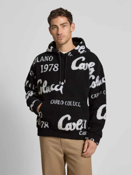 Zdjęcie produktu Bluza typu oversized z kapturem i kieszenią kangurką Carlo Colucci Czarny