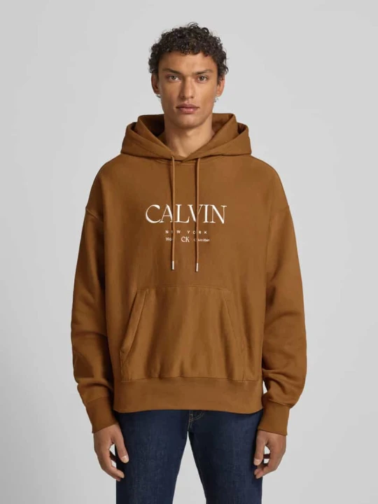 Zdjęcie produktu Bluza z kapturem z nadrukiem z logo i kieszenią kangurka Calvin Klein Musztardowy