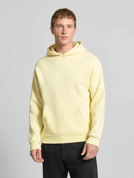 Zdjęcie produktu Bluza z kapturem o kroju regular fit z nadrukiem z logo REVIEW Jasnożółty