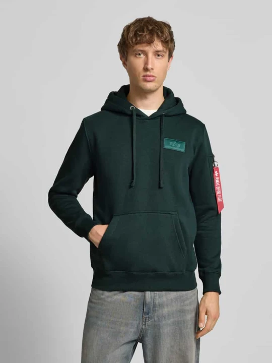 Zdjęcie produktu Bluzka o kroju regular fit z kapturem i naszywką z logo Alpha Industries Petrol