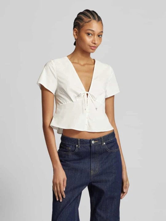 Zdjęcie produktu Bluzka o kroju regular fit z listwą guzikową Tommy Jeans Złamany biały