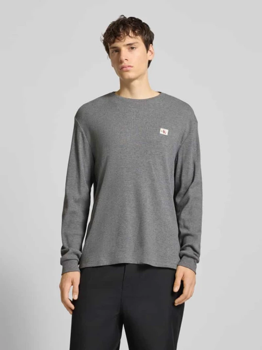 Zdjęcie produktu Bluzka o kroju slim fit z długim rękawem i naszywką z logo model ‘Waffle’ Calvin Klein Jeans Średnioszary