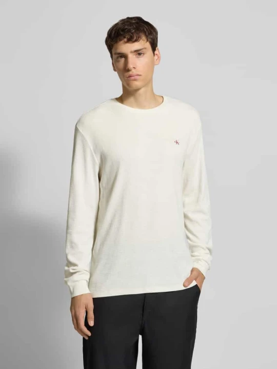 Zdjęcie produktu Bluzka z długim rękawem i detalem z logo Calvin Klein Jeans Złamany biały