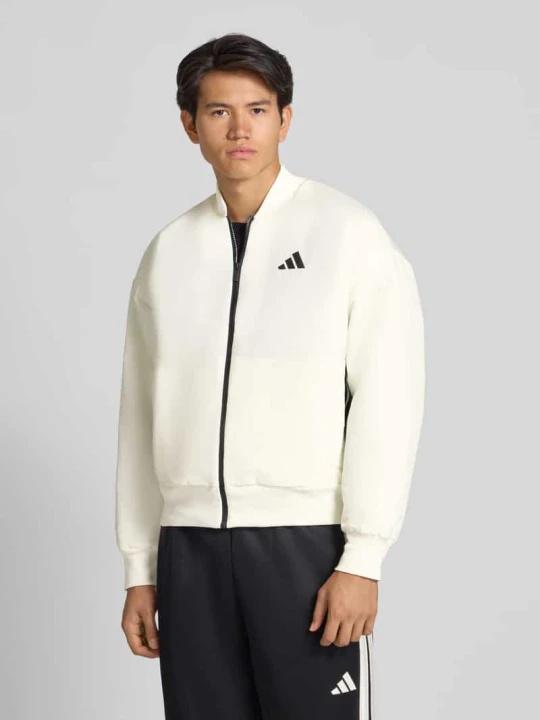 Zdjęcie produktu Bomberka o kroju relaxed fit z nadrukiem z logo model ‘Stadium’ Adidas Złamany biały