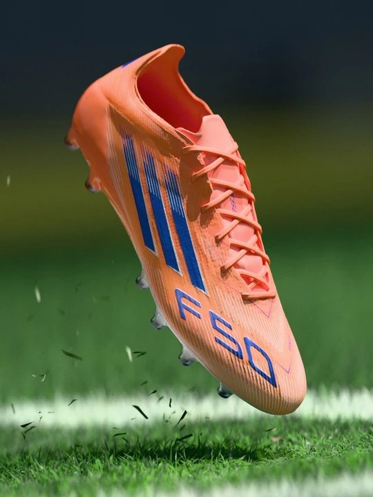 Zdjęcie produktu Buty piłkarskie na sztuczną trawę Adidas pomarańczowy
