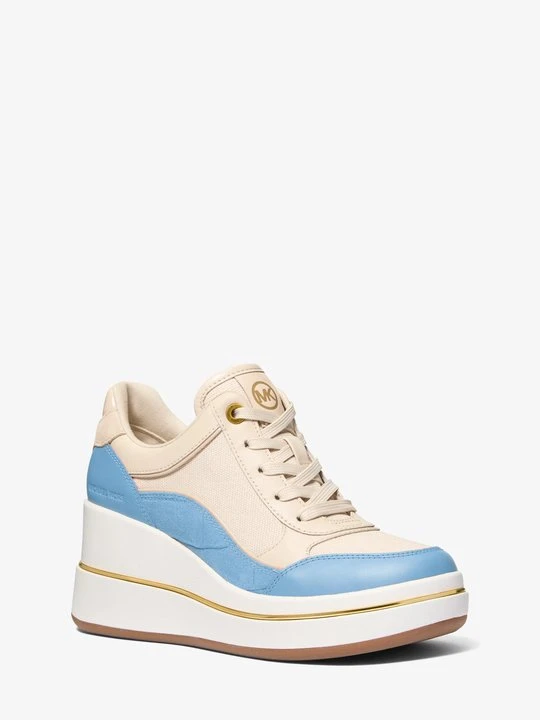 Zdjęcie produktu Buty sportowe na koturnie Emmy ze skóry i płótna Michael Kors CHAMBRAY (Niebieski)