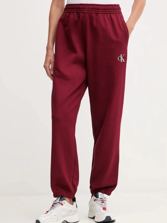 Zdjęcie produktu Calvin Klein Jeans spodnie dresowe damskie z bawełną bordowy