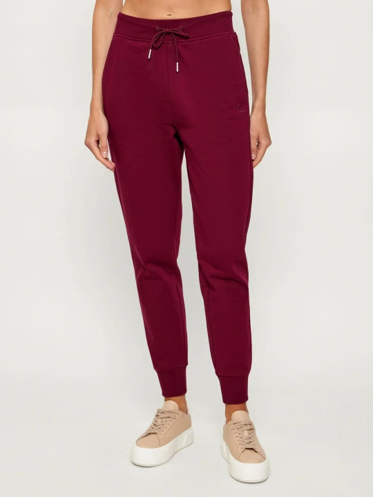 Zdjęcie produktu Calvin Klein Jeans Spodnie dresowe ARCHIVE | Slim Fit bordowy