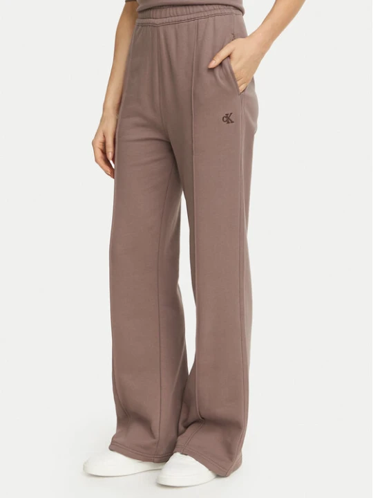 Zdjęcie produktu Calvin Klein Jeans Spodnie dresowe Monogram LV047H220G Beżowy ciemny Flare Fit