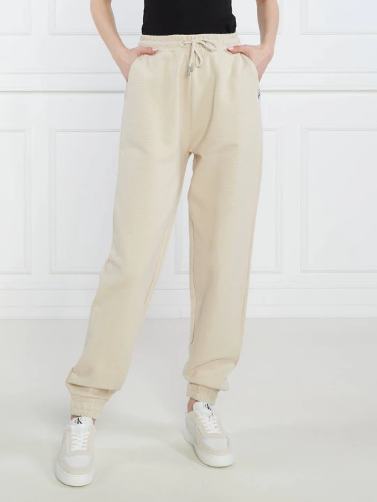 Zdjęcie produktu Calvin Klein Jeans Spodnie dresowe TAB OTTOMAN | Straight fit beżowy