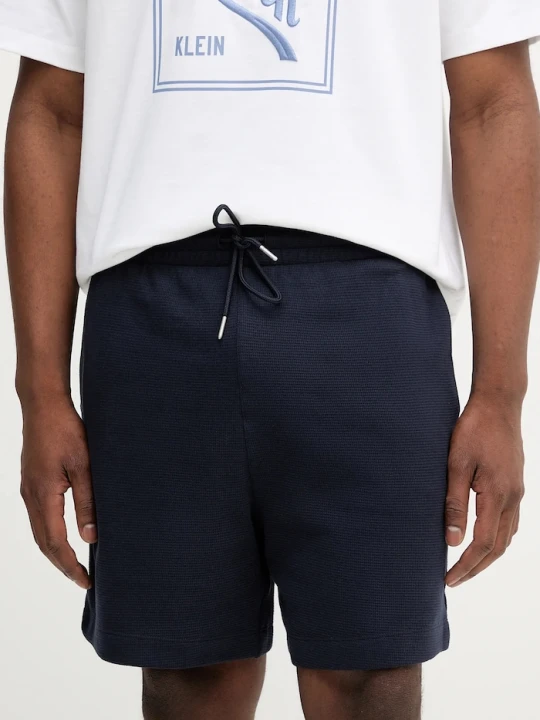 Zdjęcie produktu Calvin Klein Jeans szorty dresowe męskie bawełniane granatowy