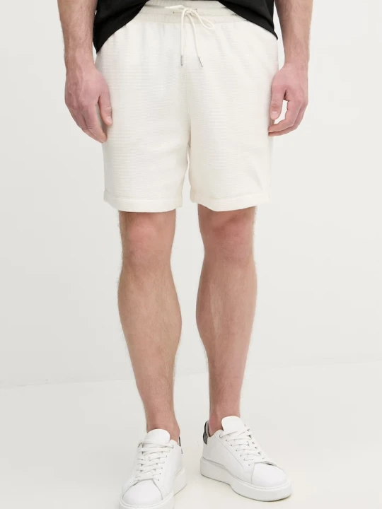 Zdjęcie produktu Calvin Klein Jeans szorty dresowe męskie bawełniane beżowy