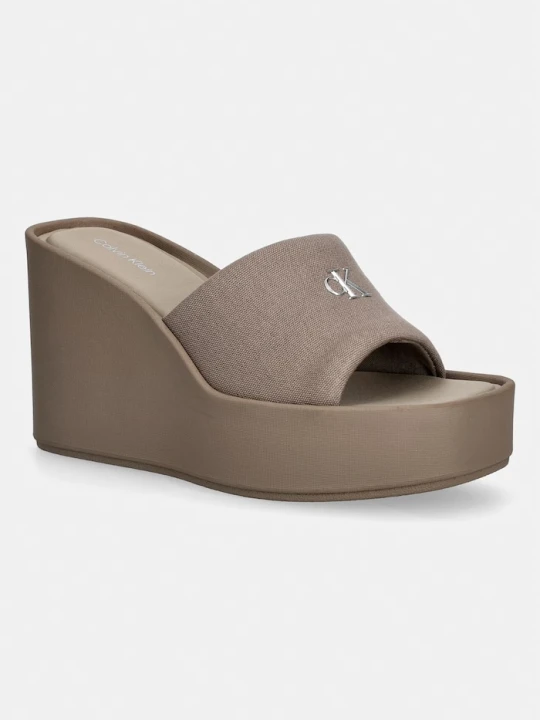 Zdjęcie produktu Calvin Klein klapki na koturnie damskie WEDGE 70 SNDL CANV MG brązowy