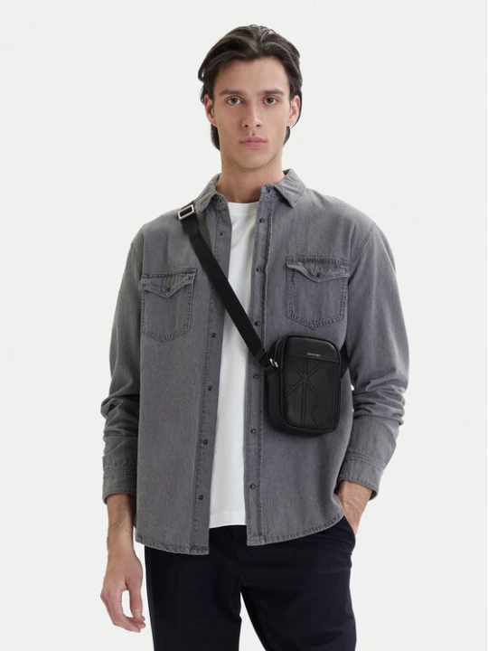 Zdjęcie produktu Calvin Klein Saszetka Emblem Aop Emboss Slim Reporter LV04D3371G Czarny