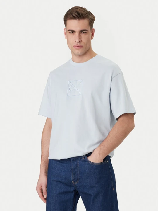 Zdjęcie produktu Calvin Klein T-Shirt Emblem Graphic LV14RF817G Błękitny Regular Fit Niebieski jasny