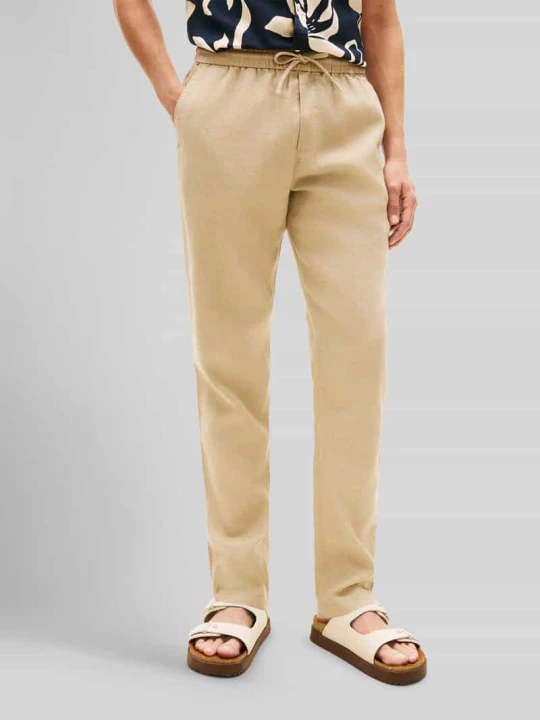 Zdjęcie produktu Chino o kroju tapered z mieszanki lnu ze ściągaczem w pasie model 'HARLEM' Tommy Hilfiger Beżowy