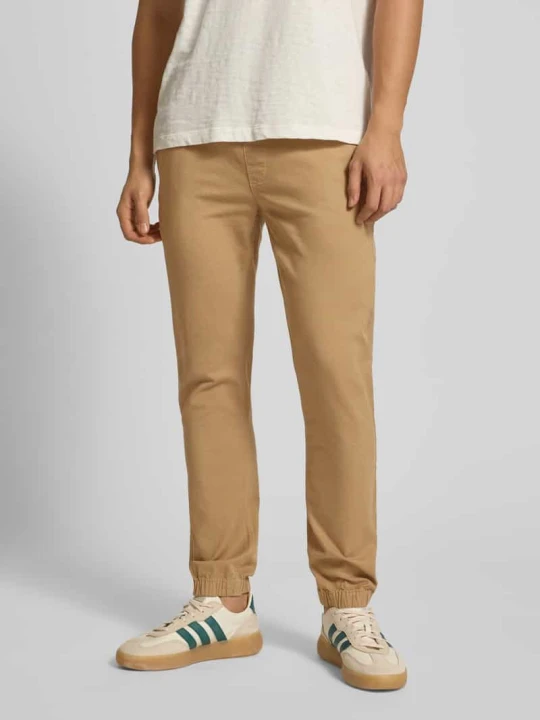 Zdjęcie produktu Chinosy o kroju slim fit z mieszanki bawełny Tommy Jeans Beżowy