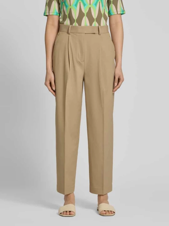 Zdjęcie produktu Chinosy o kroju tapered fit z wpuszczanymi kieszeniami Tommy Hilfiger Piaskowy