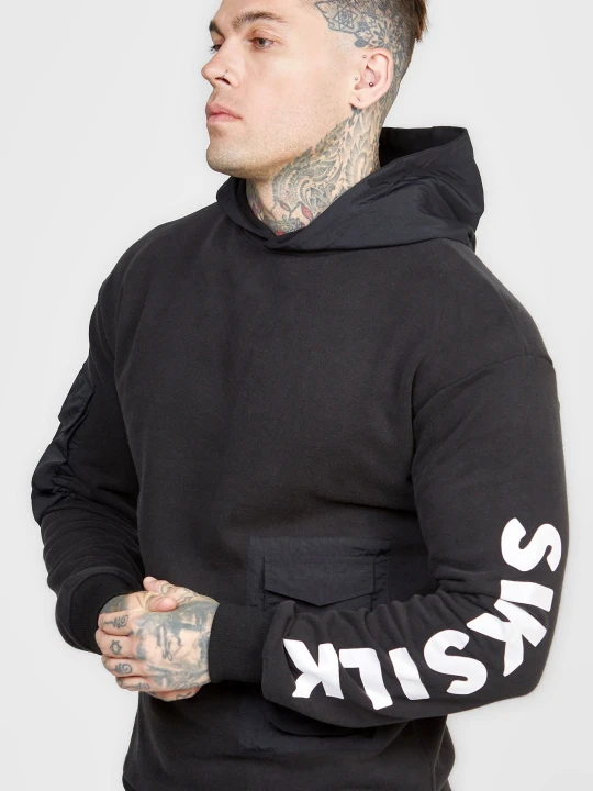 Zdjęcie produktu Czarna oversize bluza męska z kapturem i kontrastową kieszenią SikSilk