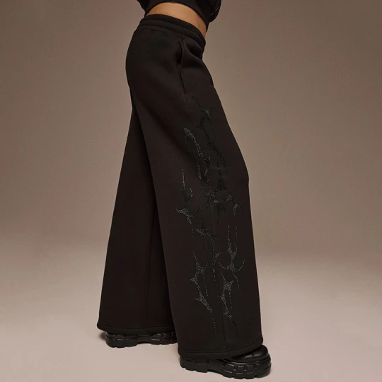 Zdjęcie produktu Czarne spodnie dresowe wide leg z aplikacją z dżetów House