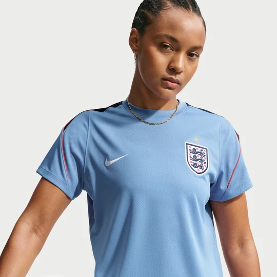 Zdjęcie produktu Damska koszulka piłkarska z krótkim rękawem Nike Dri-FIT Anglia Strike - Niebieski