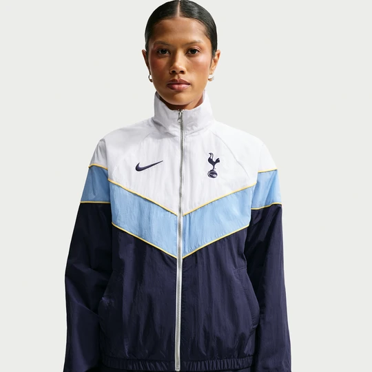 Zdjęcie produktu Damska kurtka piłkarska z tkaniny z ochroną przed promieniowaniem UV Nike Tottenham Hotspur Windrunner - Niebieski