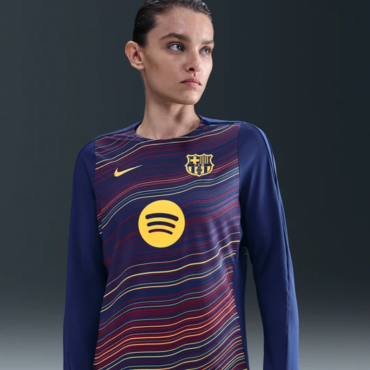 Zdjęcie produktu Damska przedmeczowa koszulka piłkarska z półokrągłym dekoltem Nike Dri-FIT FC Barcelona Strike (wersja domowa) - Niebieski