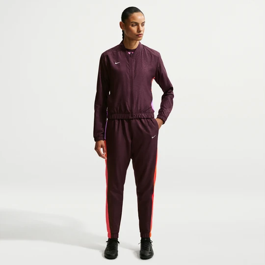 Zdjęcie produktu Damski dres piłkarski z tkaniny Dri-FIT Nike United Academy - Czerwony