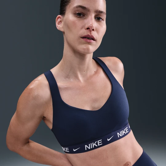 Zdjęcie produktu Damski regulowany stanik sportowy z wkładkami Nike Indy High Support - Niebieski