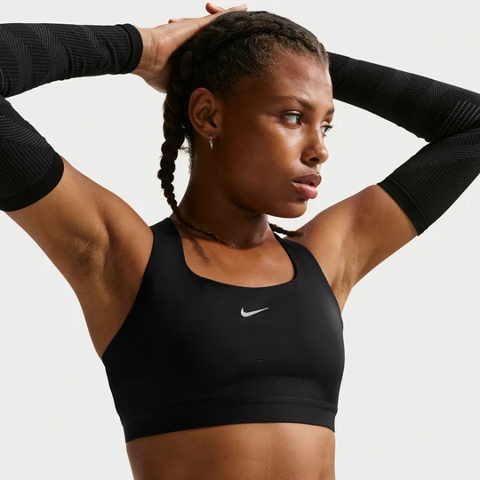 Zdjęcie produktu Damski stanik sportowy z lekką podszewką zapewniający wysokie wsparcie Nike Swift - Czerń