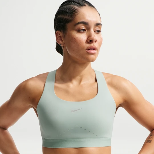 Zdjęcie produktu Damski stanik sportowy z lekką podszewką zapewniający wysokie wsparcie Nike Swift - Zieleń