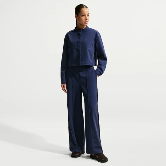 Zdjęcie produktu Damskie luźne spodnie z wysokim stanem i rozpinanymi nogawkami Dri-FIT Nike 24.7 PerfectStretch - Niebieski