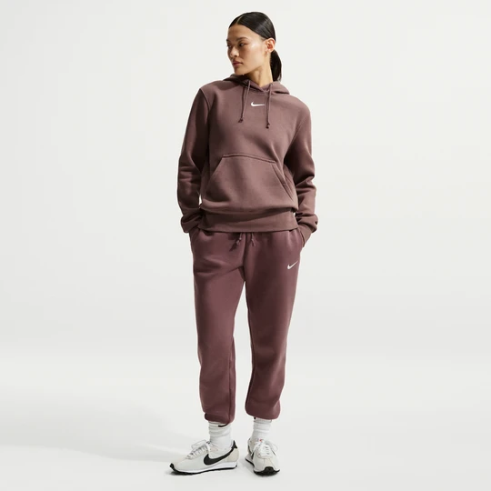 Zdjęcie produktu Damskie spodnie dresowe ze średnim stanem Nike Phoenix Fleece - Fiolet