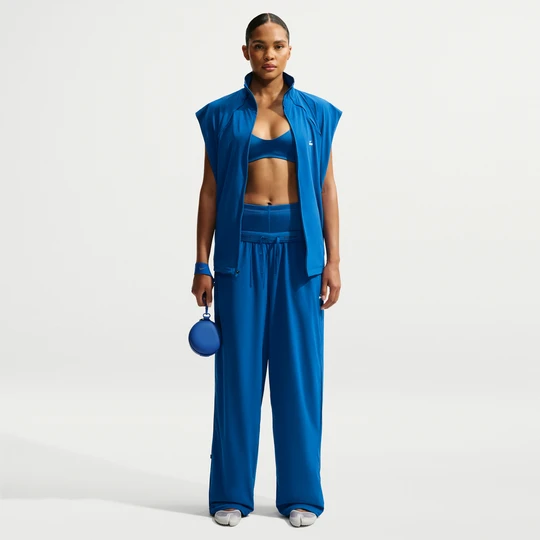 Zdjęcie produktu Damskie spodnie o kroju oversize NikeSKIMS Stretch Nylon - Niebieski