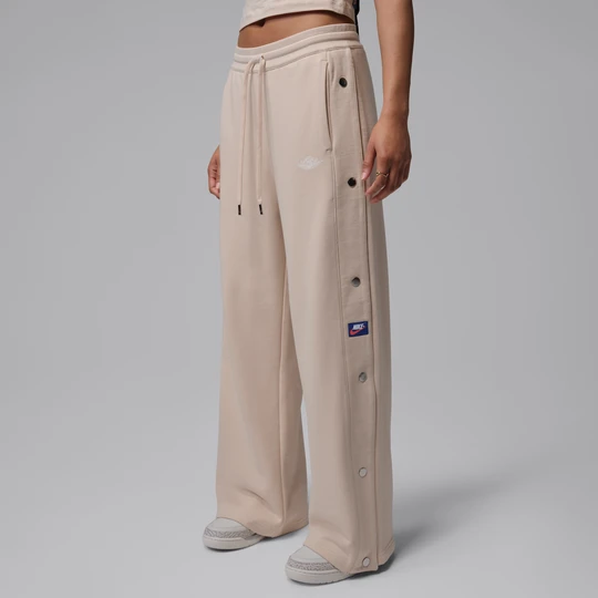 Zdjęcie produktu Damskie spodnie z dzianiny dresowej na zatrzaski Jordan Flight Fleece - Biel