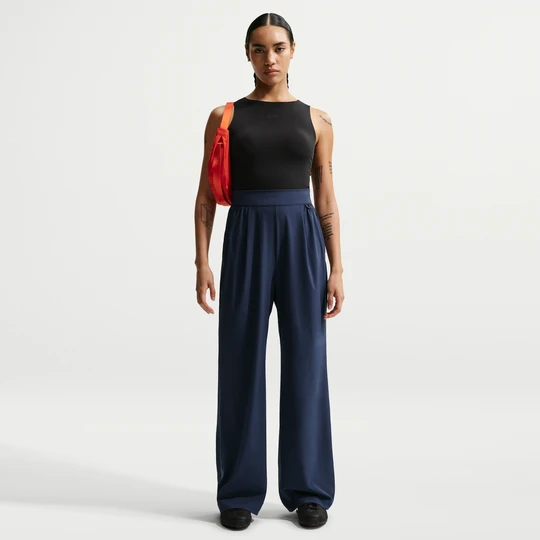 Zdjęcie produktu Damskie spodnie z wysokim stanem i luźnymi szerokimi nogawkami Dri-FIT Nike 24.7 PerfectStretch - Niebieski