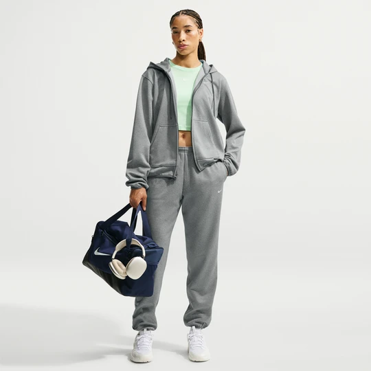 Zdjęcie produktu Damskie spodnie ze średnim stanem Therma-FIT Nike Studio Fleece Sport - Szary