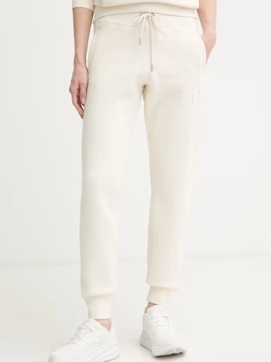 Zdjęcie produktu DKNY spodnie dresowe damskie z bawełną beżowy