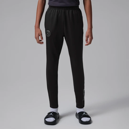 Zdjęcie produktu Dzianinowe spodnie piłkarskie dla dużych dzieci Jordan Dri-FIT Paris Saint-Germain Strike (wersja czwarta) - Czerń