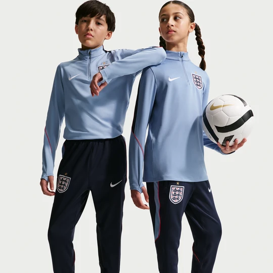 Zdjęcie produktu Dzianinowe spodnie piłkarskie dla dużych dzieci Nike Dri-FIT Anglia Strike - Niebieski